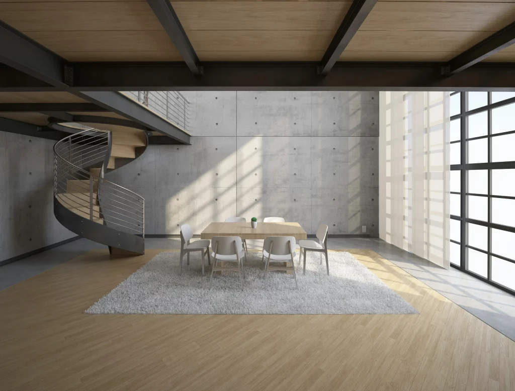Un loft avec un escalier elliptiques
