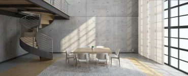 Un loft avec un escalier elliptiques